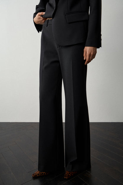 CREASED FLARE TROUSERS