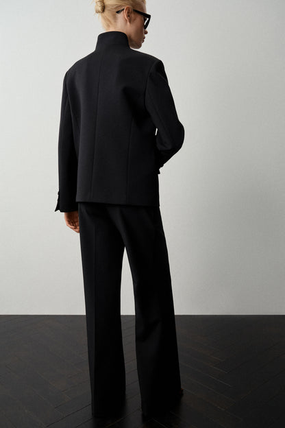 CREASED FLARE TROUSERS